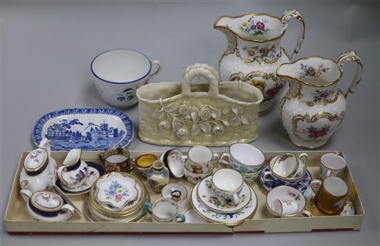 A Belleek basket, two 19th century flower-decorated jugs and a quantity of miniature tableware